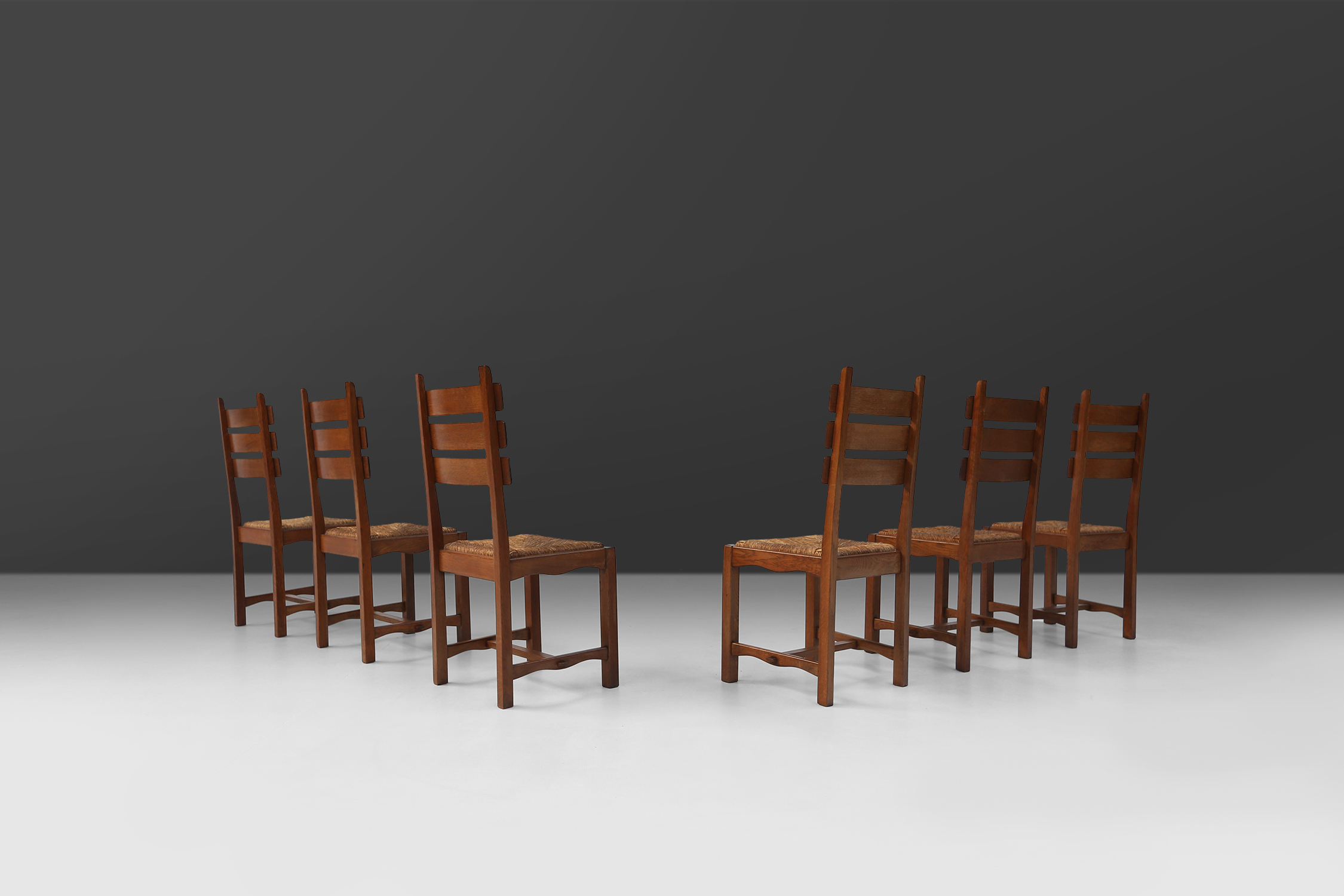 Set of six brutalist dining chairs in oak and wickerthumbnail
